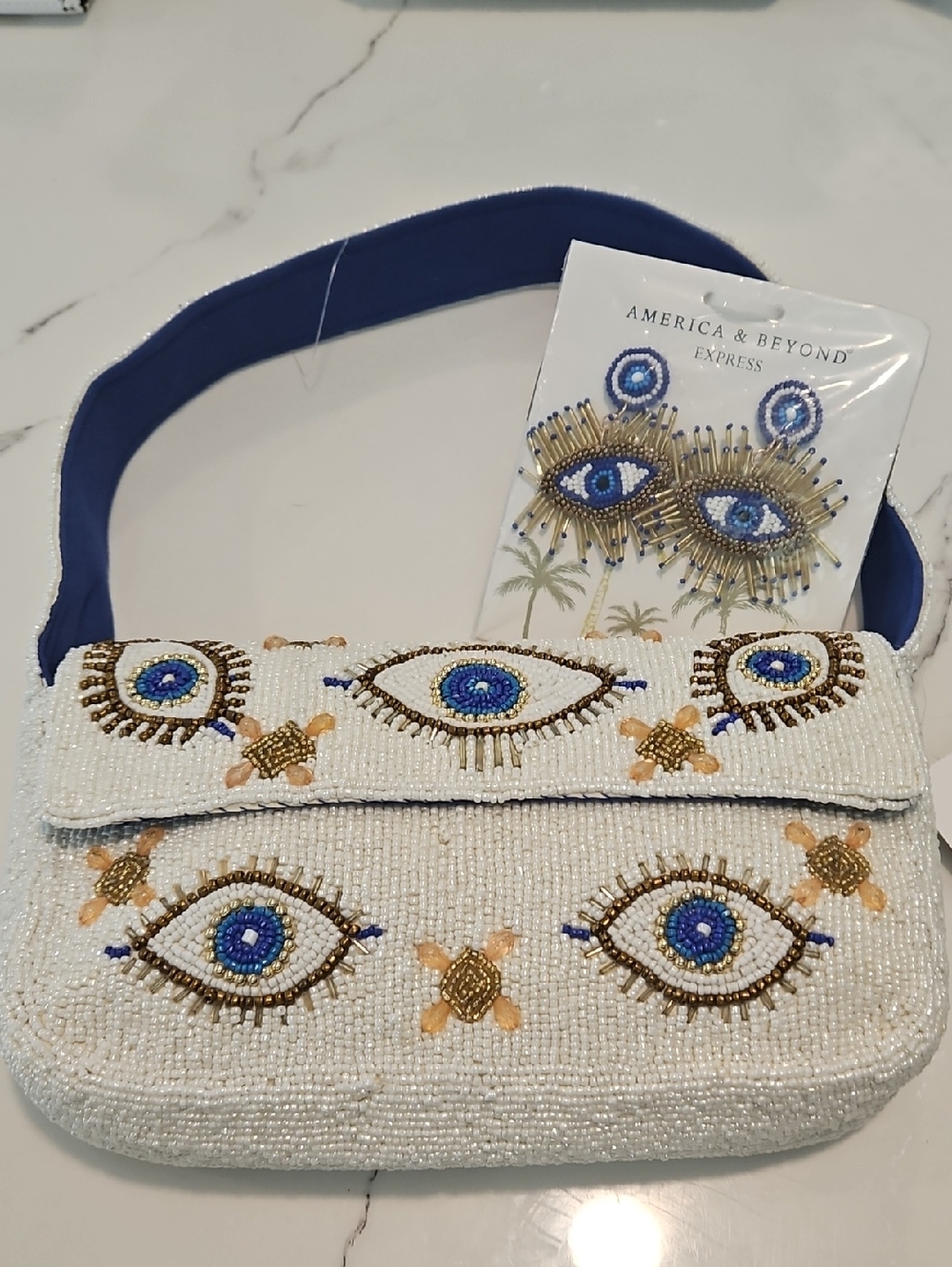 Beaded White Eye Motif Shoulder Bag with Blue Strap